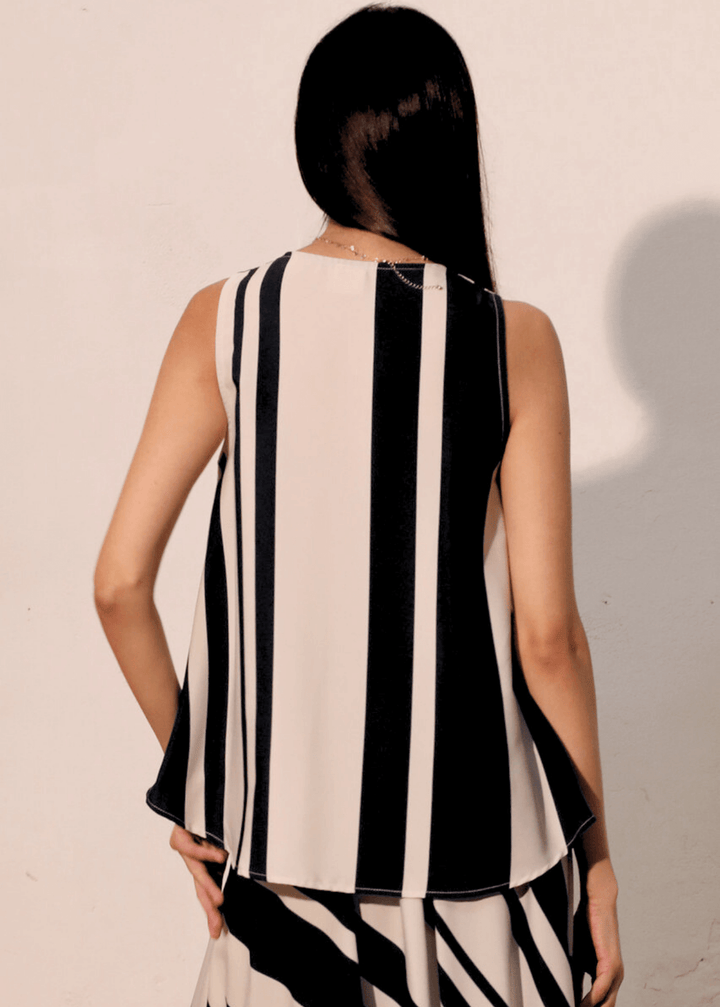 Effortless sophistication meets everyday comfort in this sleeveless striped top. The classic black and ivory stripe pattern pairs with a flattering V-neckline, while strategic front gathering creates the polished look of a tucked-in style. Made in USA