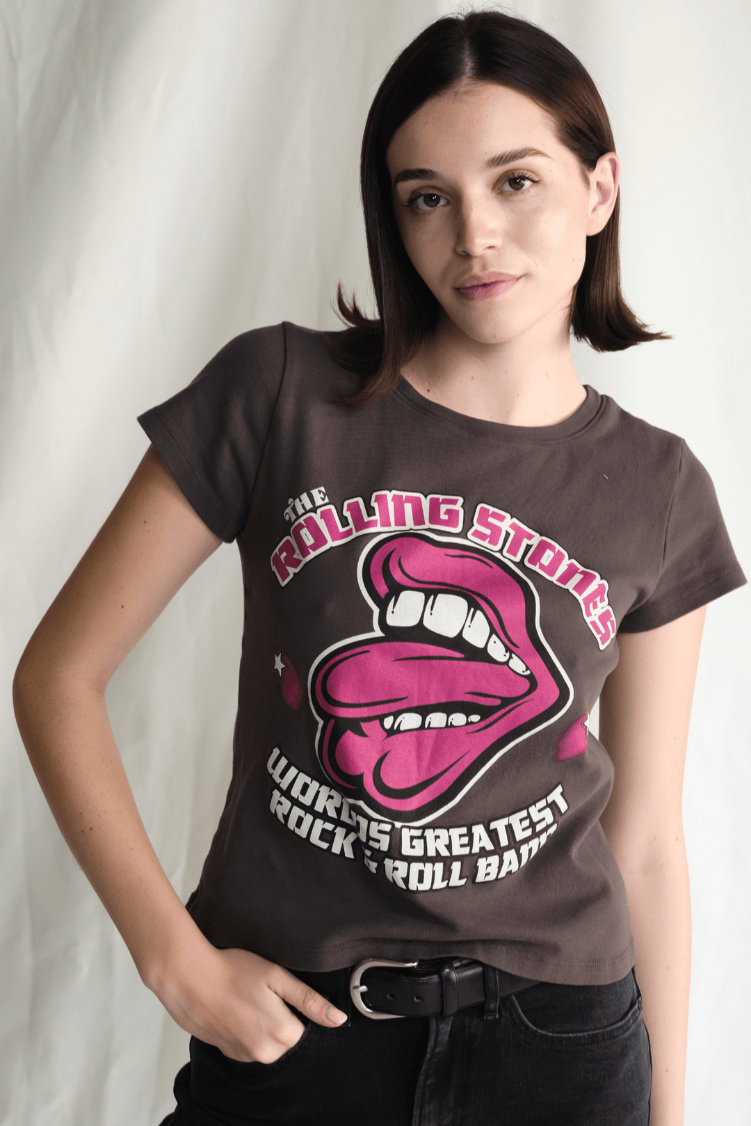 Shop the Rolling Stones World's Greatest Baby Tee by People of Leisure — vintage band tee, 100% cotton, Vintage Black. Made in USA. Sizes XS–XL.
