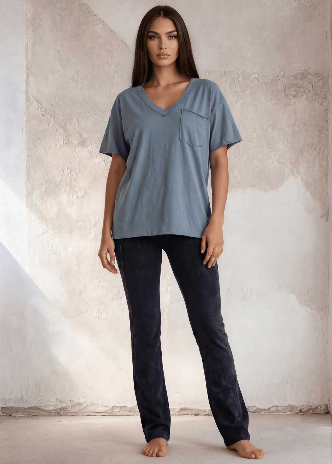 This Made in USA Slate Blue T-Shirt offers a relaxed fit made from soft, 100% cotton medium-weight fabric that is garment washed for lasting comfort. Featuring a raw edge detail and a convenient front pocket, this short-sleeve tee is perfect for everyday wear.