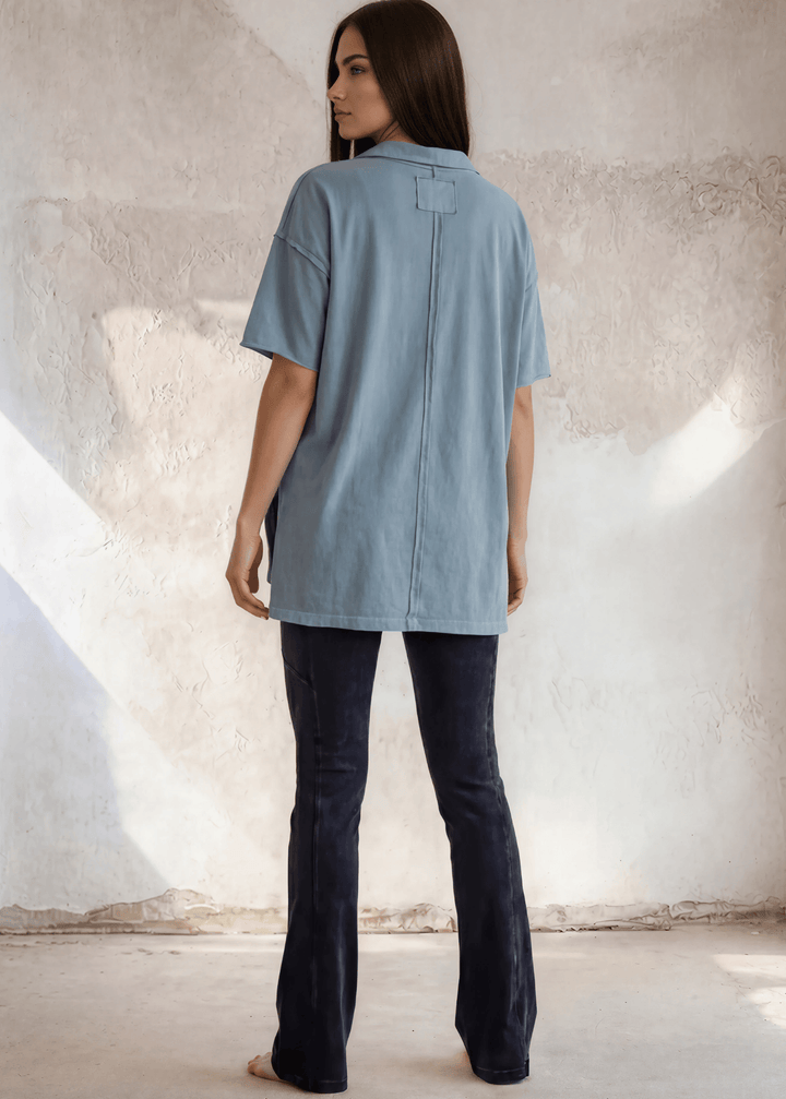This Made in USA Slate Blue T-Shirt offers a relaxed fit made from soft, 100% cotton medium-weight fabric that is garment washed for lasting comfort. Featuring a raw edge detail and a convenient front pocket, this short-sleeve tee is perfect for everyday wear.