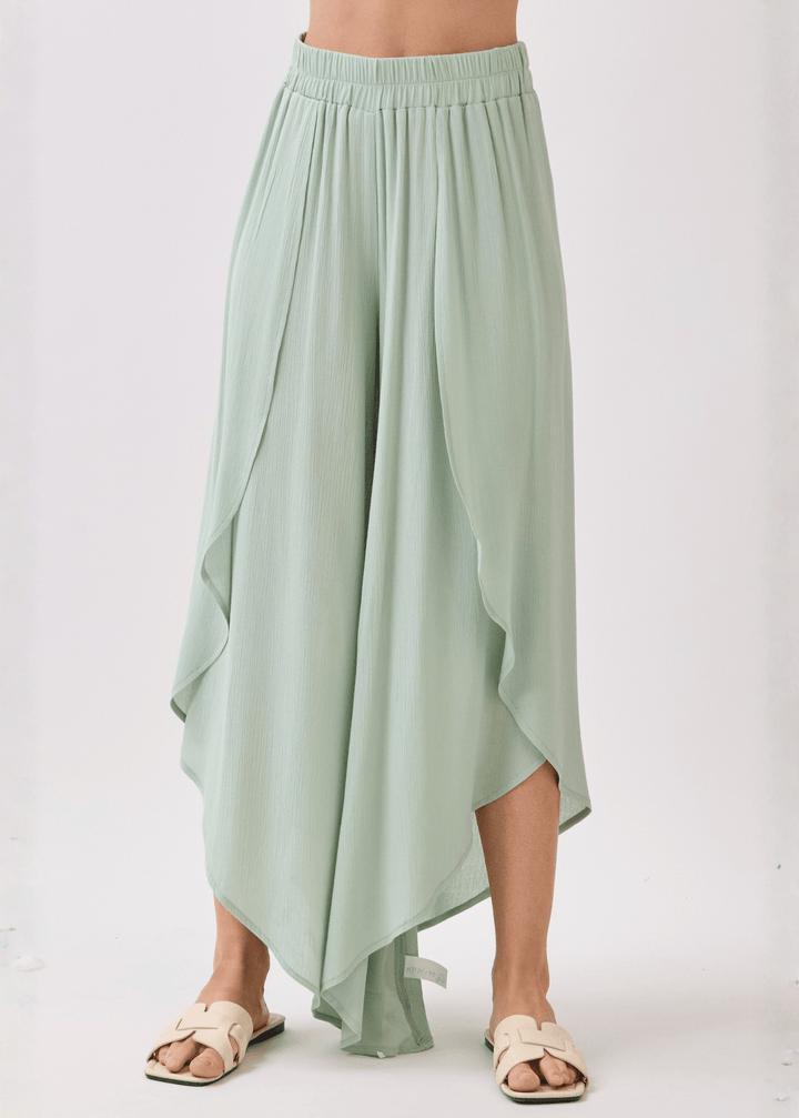 Breezy sage green flowy pants with elastic waist &amp; overlap split leg detail. Lightweight 100% rayon. Made in USA. Perfect for vacation &amp; resort wear.