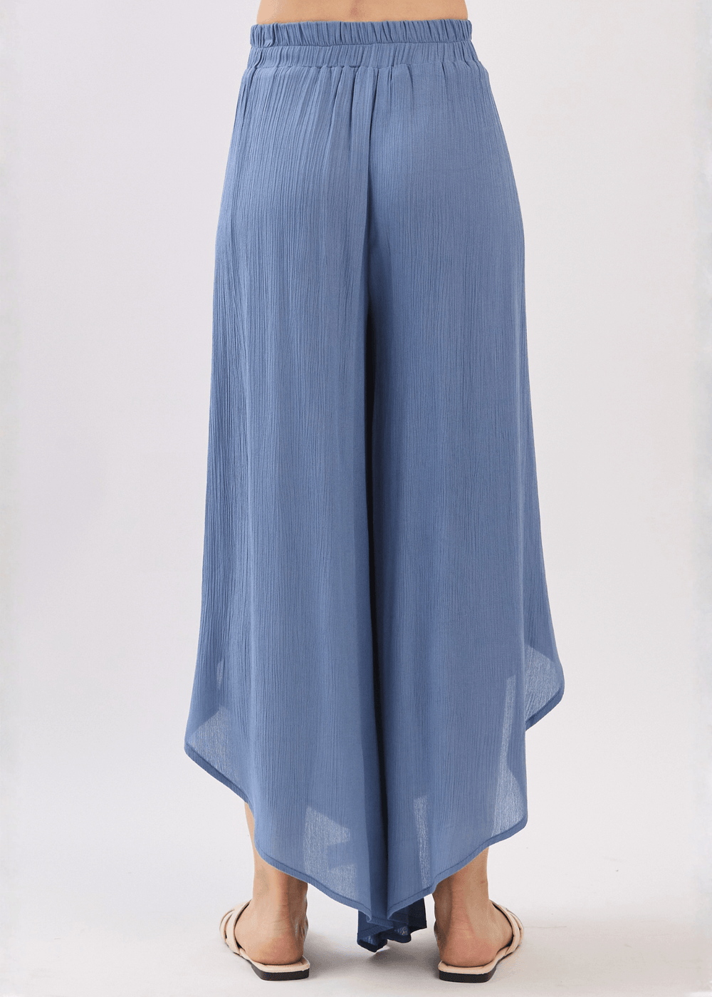Breezy Denim Blue flowy pants with elastic waist & overlap split leg detail. Lightweight 100% rayon. Made in USA. Perfect for vacation & resort wear.