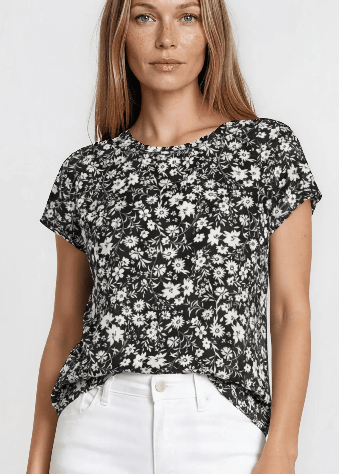 Faith's Floral Print Tee in Black. Soft stretch knit, allover ditsy floral, crew neck, regular fit. Effortlessly stylish. Made in USA. Sizes S–XL.