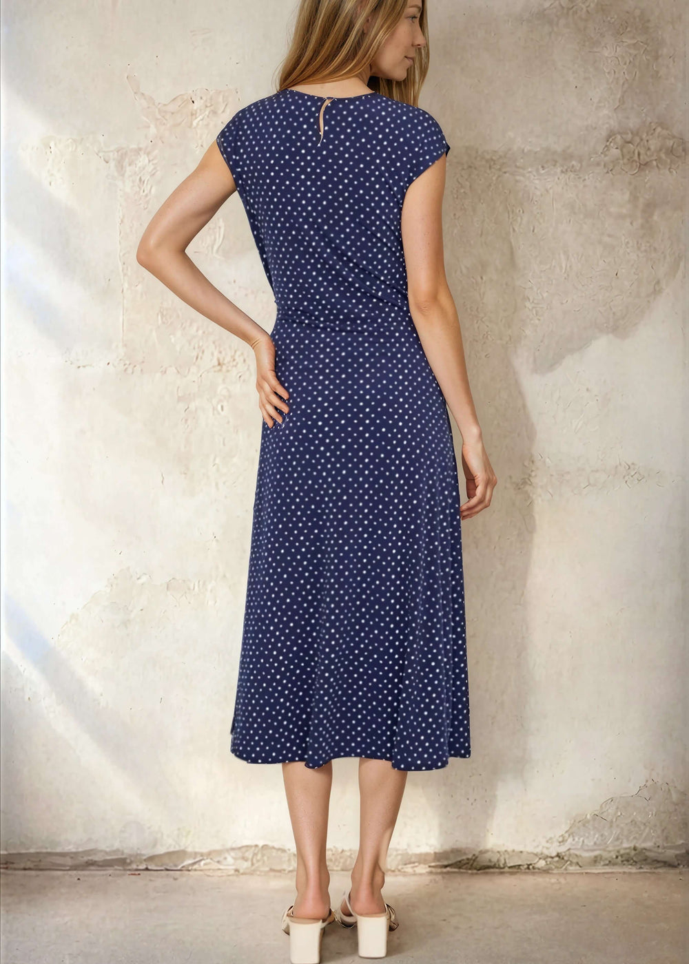 USA-made women's navy polka dot midi dress with a side-tie waist & flared skirt. Cap sleeves, V-neck, sizes S–XL