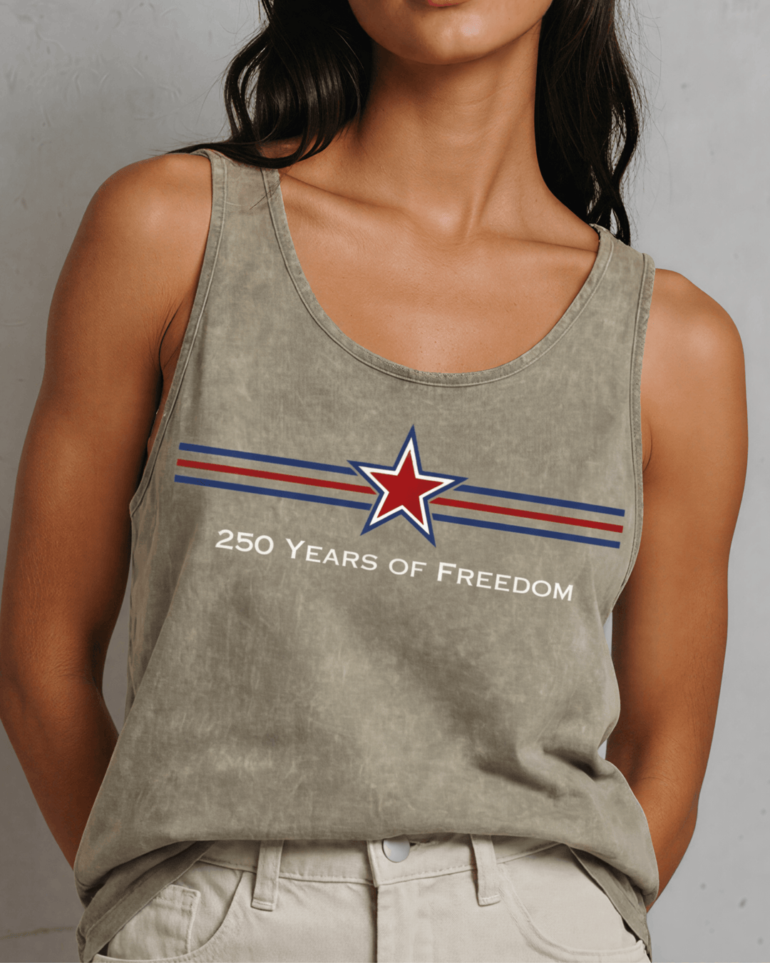 Celebrate America's 250th with this bold star graphic tank in stone mineral wash. USA-made, USA-grown cotton, 95% cotton/5% spandex, relaxed fit.