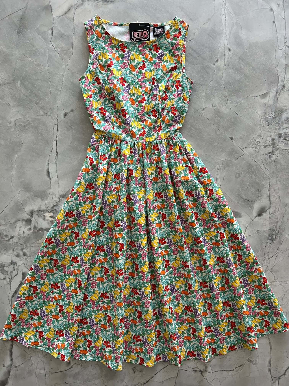 Made in USA, A women's vintage style piece with fun, modern details; our midi dress is now available in our Floral print. Made from 100% cotton