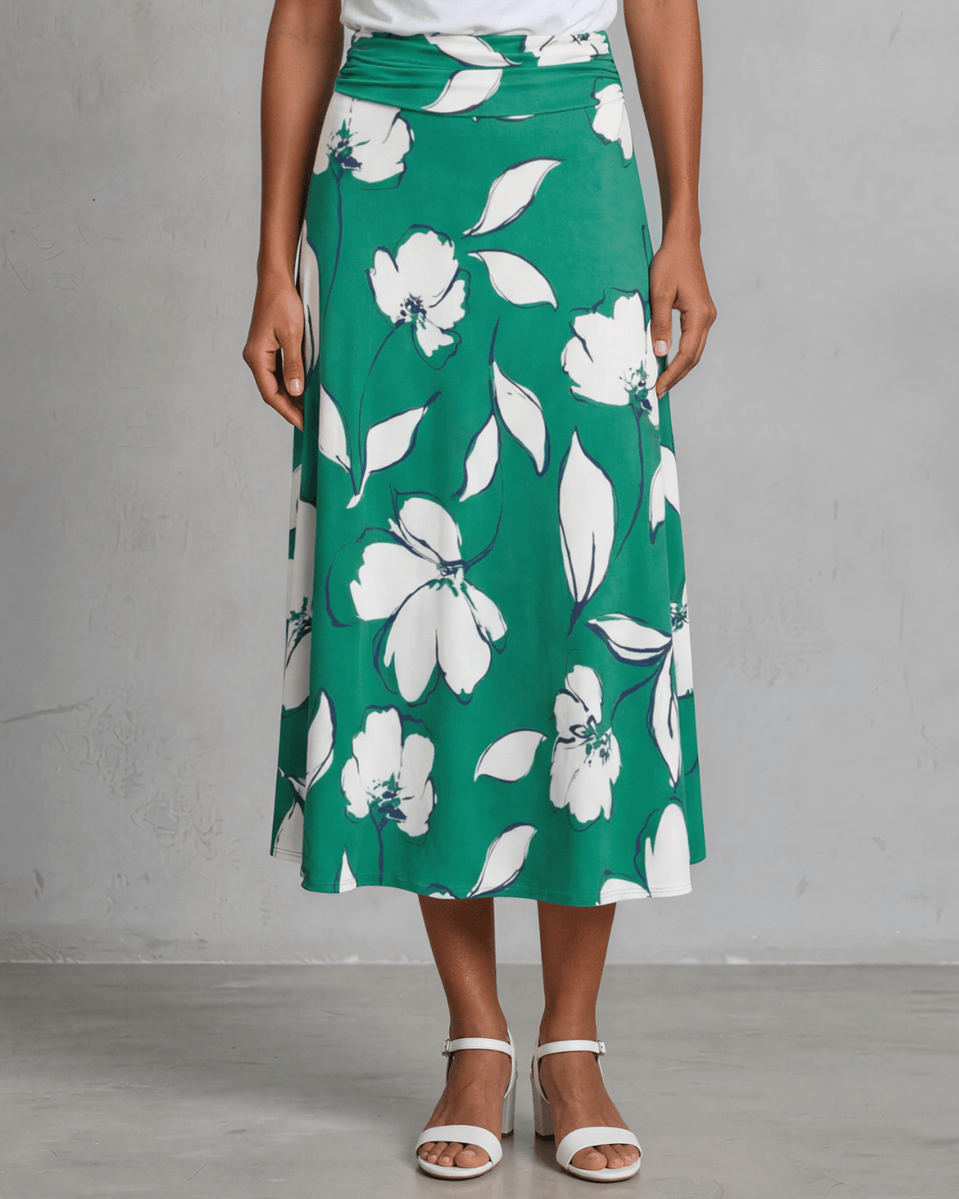 Shop the Marie Floral Maxi Skirt in bold green & white. A-line silhouette, ruched waistband, sizes S-L. 95% Poly/5% Spandex. Made in USA.