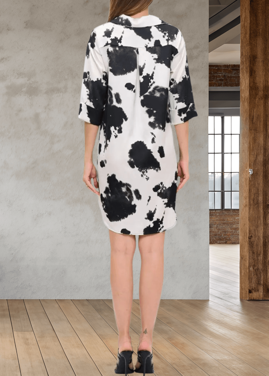USA Crafted Satin Kali Mini Shirt Dress or Tunic, features a striking black and white cow print that adds bold style to your wardrobe. Designed with a classic collar, half sleeves, and button-front closure | Renee C. Style 5177TPA