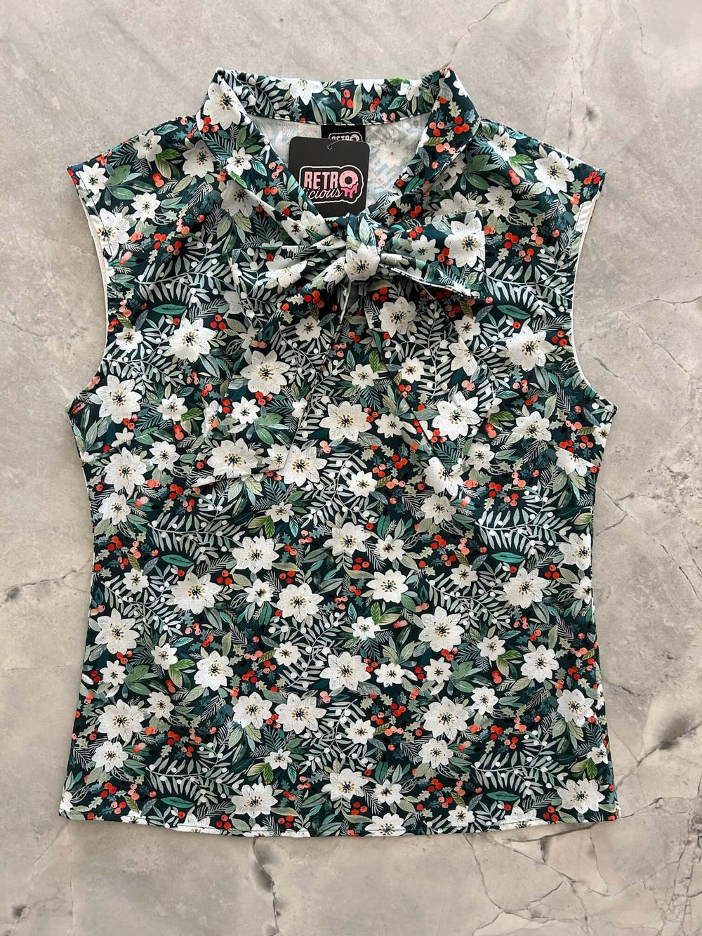 Made in USA, this women's top is for the vintage lover at heart! Now available in our Winter Floral print. This 100% cotton top features bust darts for a flattering silhouette, a side zippered closure for ease of wear