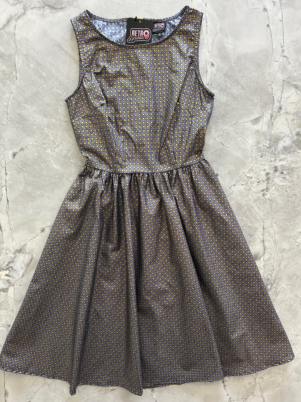 Made in USA. Shop the Isabella Vintage Dress by Retrolicious in 100% cotton, with a gold-and-blue print, high neckline, full skirt and hidden pockets.