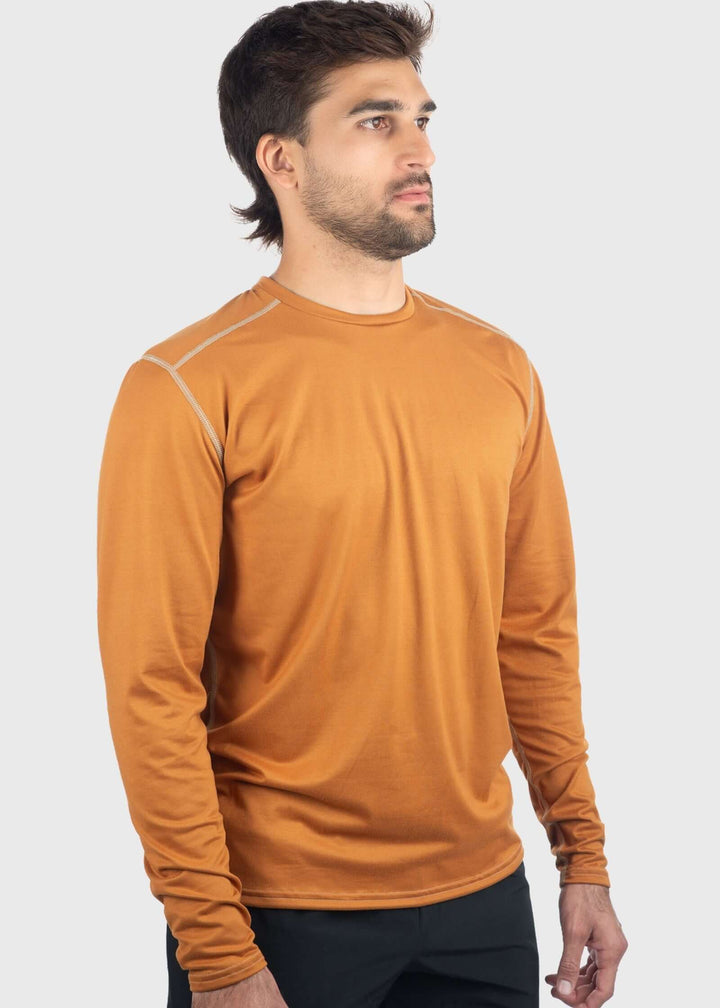 Experience comfort and protection with the Essential SoftTECH™ Shirt. This lightweight long sleeve tee features a relaxed fit, back yoke, and flat seams designed to keep you comfortable all day. Built-in UPF 50 offers reliable sun protection, making it perfect for any spring activity. Available in multiple colors and proudly made in the USA since 1990, this shirt is a versatile wardrobe essential you&