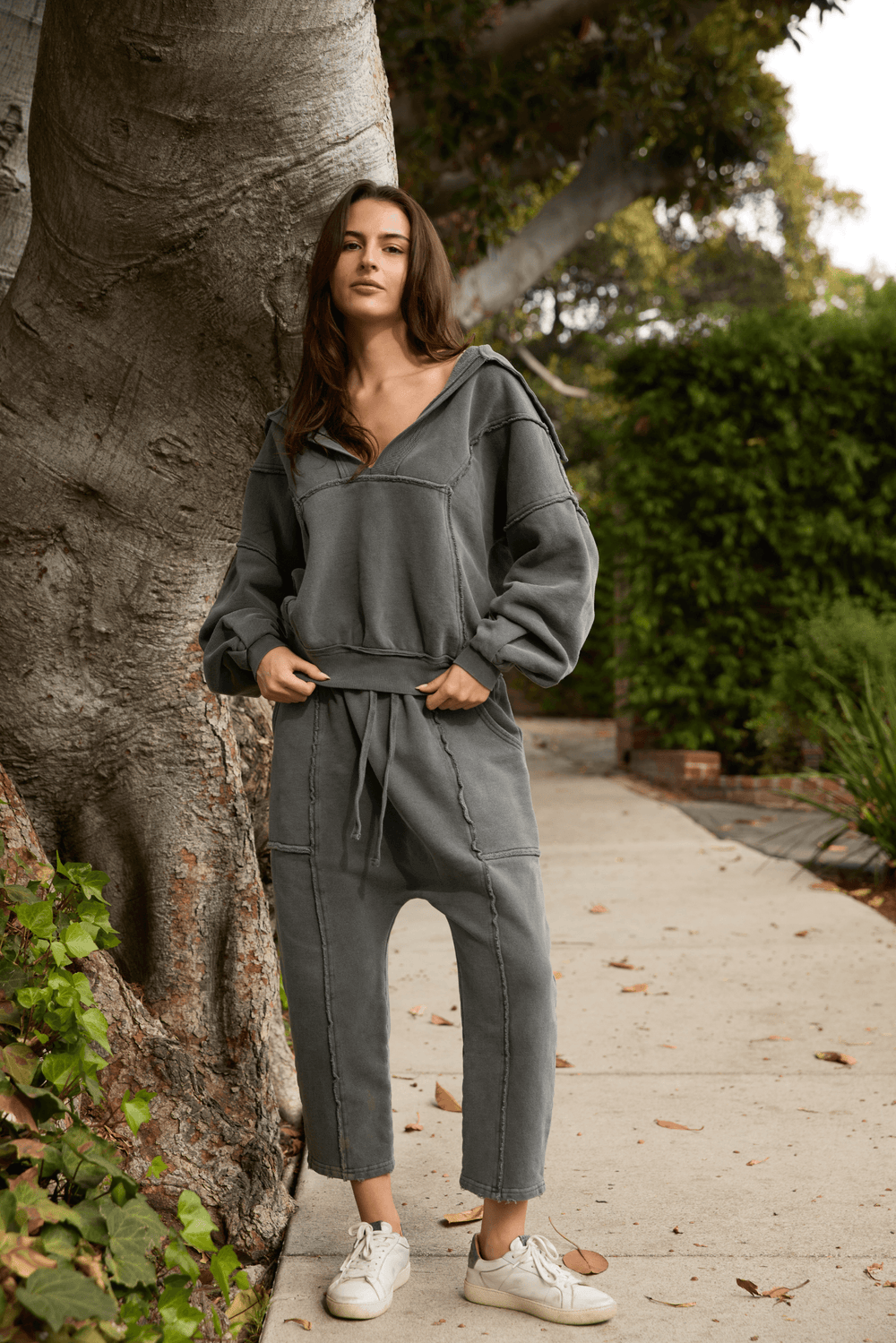  Ryanne Sweatshirt by People of Leisure — 100% organic cotton, deep V-neck, raw edges in Camel & Vintage Black. Made in LA. Sizes XS–XL