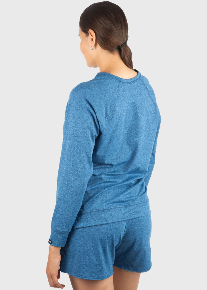 Experience unmatched comfort with the SoftTECH™ Pro Relaxed Fit Long Sleeve Top. Crafted from buttery soft, lightweight fabric, it offers breathability and a flattering loose fit with a notch opening on the hem for extra ease of movement. The 4-way stretch enhances flexibility, making it ideal for workouts or everyday wear. Plus, built-in UPF 50 provides essential sun protection, keeping you safe during outdoor activities. Elevate your activewear with a top that combines style, comfort, and performance effo