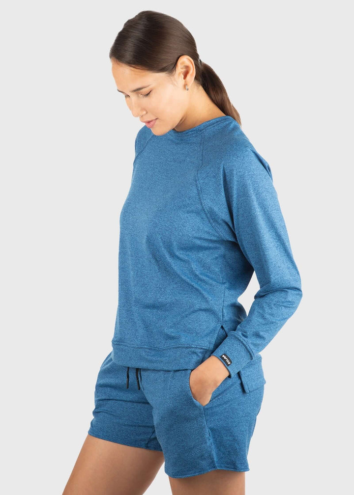 Experience unmatched comfort with the SoftTECH™ Pro Relaxed Fit Long Sleeve Top. Crafted from buttery soft, lightweight fabric, it offers breathability and a flattering loose fit with a notch opening on the hem for extra ease of movement. The 4-way stretch enhances flexibility, making it ideal for workouts or everyday wear. Plus, built-in UPF 50 provides essential sun protection, keeping you safe during outdoor activities. Elevate your activewear with a top that combines style, comfort, and performance effo