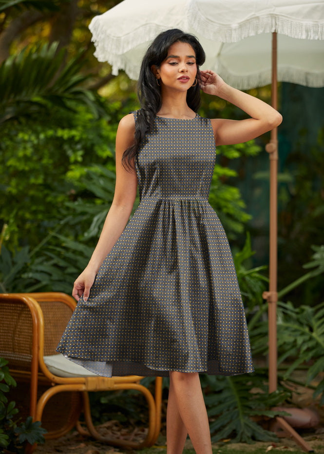 Made in USA. Shop the Isabella Vintage Dress by Retrolicious in 100% cotton, with a gold-and-blue print, high neckline, full skirt and hidden pockets.