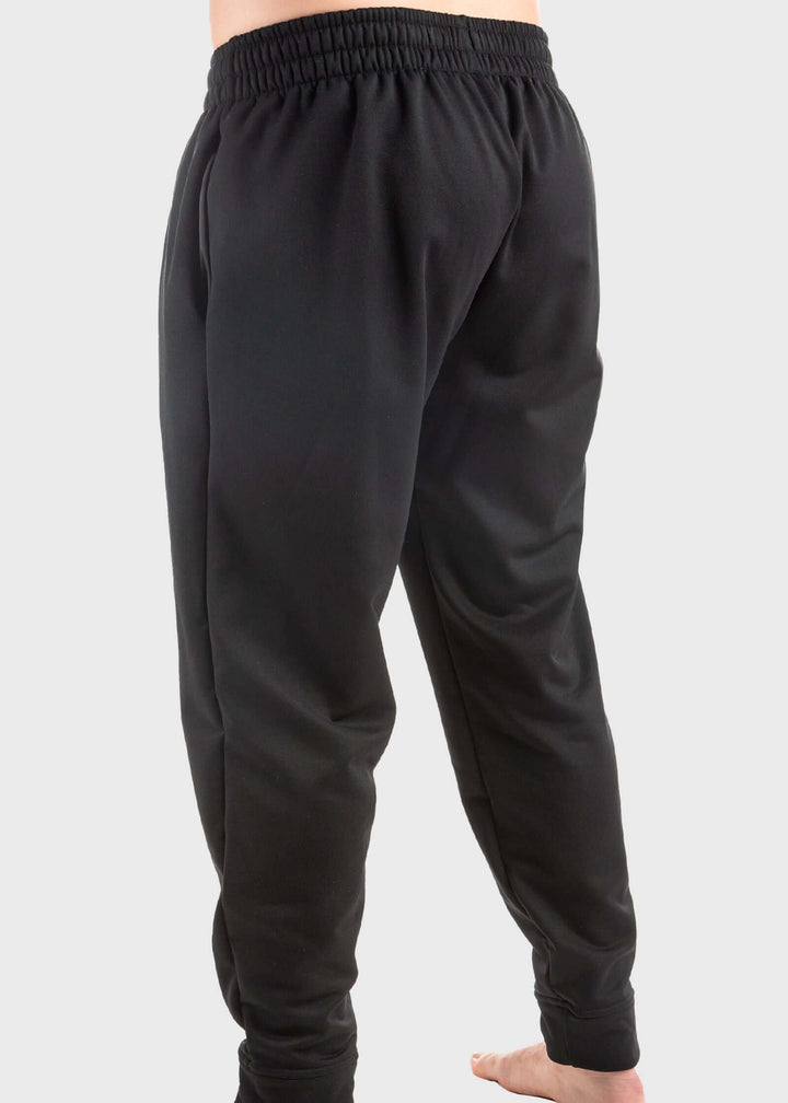Experience unmatched comfort and durability with the Highland Fleece Sweatpant. Made from a cozy 14oz mid-weight fleece, these pants feature a brushed lining that keeps you warm during fall and perfect for layering in winter. Crafted from 99% cotton with a touch of spandex, they offer a loose fit with cuffs on the hem for a tailored feel. Convenient side pockets and an extra welt zippered pocket combine practicality with style. Proudly made in the USA since 1990, these sweatpants deliver warmth, functionali