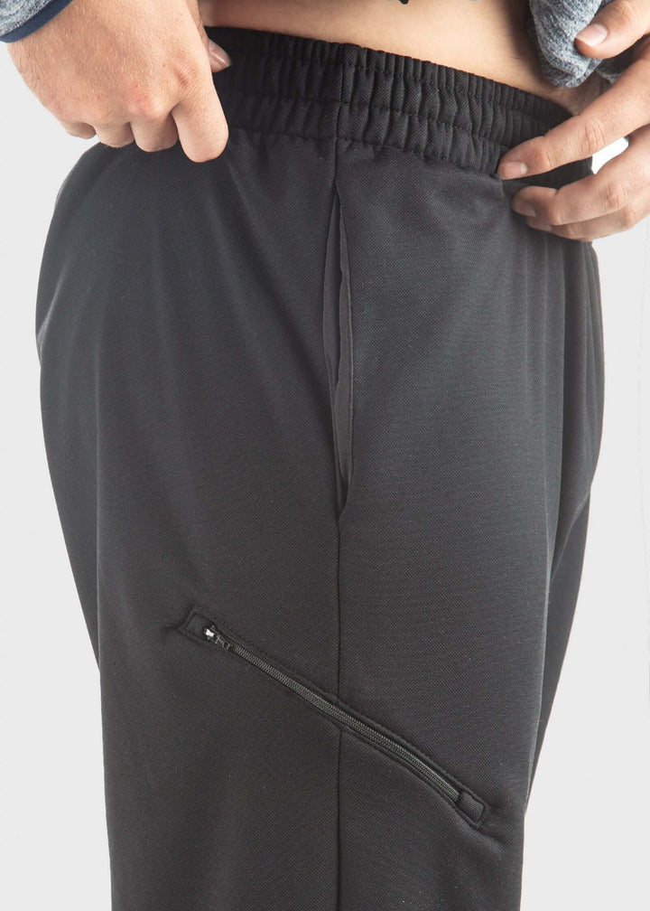 Experience unmatched comfort and durability with the Highland Fleece Sweatpant. Made from a cozy 14oz mid-weight fleece, these pants feature a brushed lining that keeps you warm during fall and perfect for layering in winter. Crafted from 99% cotton with a touch of spandex, they offer a loose fit with cuffs on the hem for a tailored feel. Convenient side pockets and an extra welt zippered pocket combine practicality with style. Proudly made in the USA since 1990, these sweatpants deliver warmth, functionali