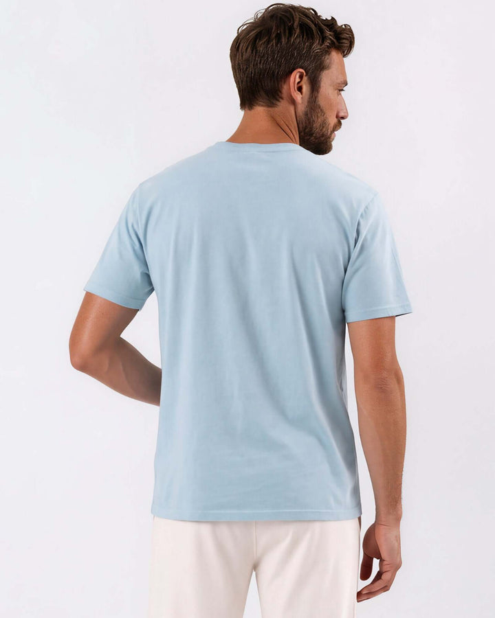 Made in USA Vintage Pigment Dyed Softest Tee - Bluestone: back view of light blue short sleeve tee on male model