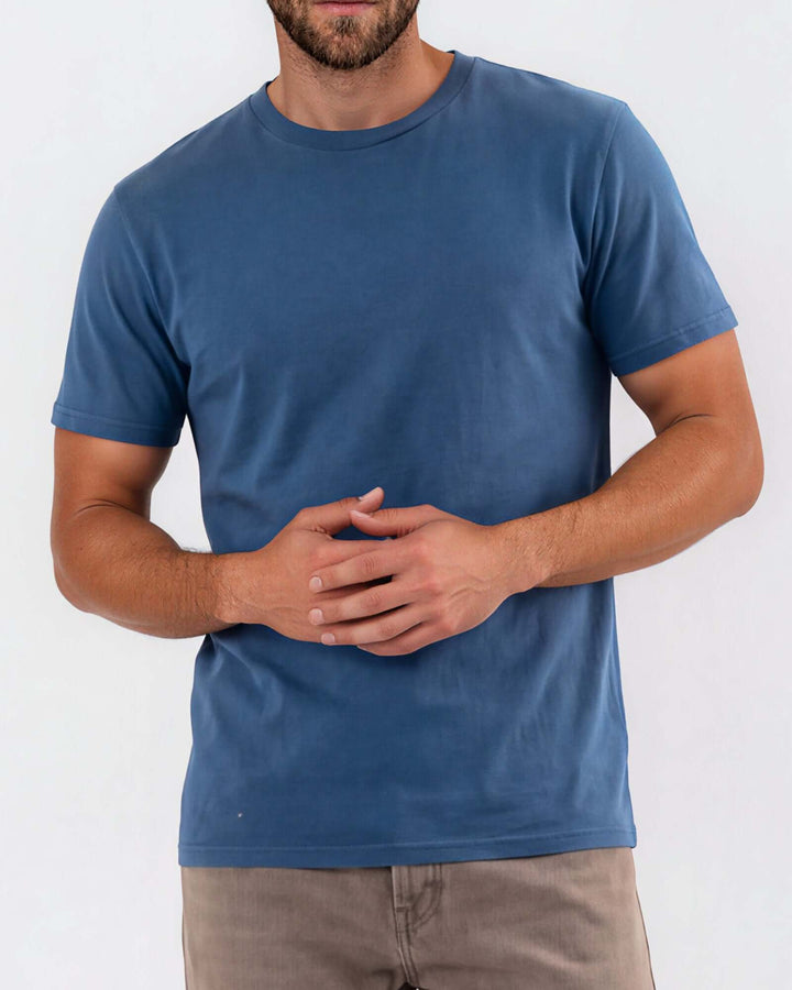 Made in USA Vintage Pigment Dyed Softest Tee - Blue Steel: close-up front view of denim blue tee showing crew neck and hem