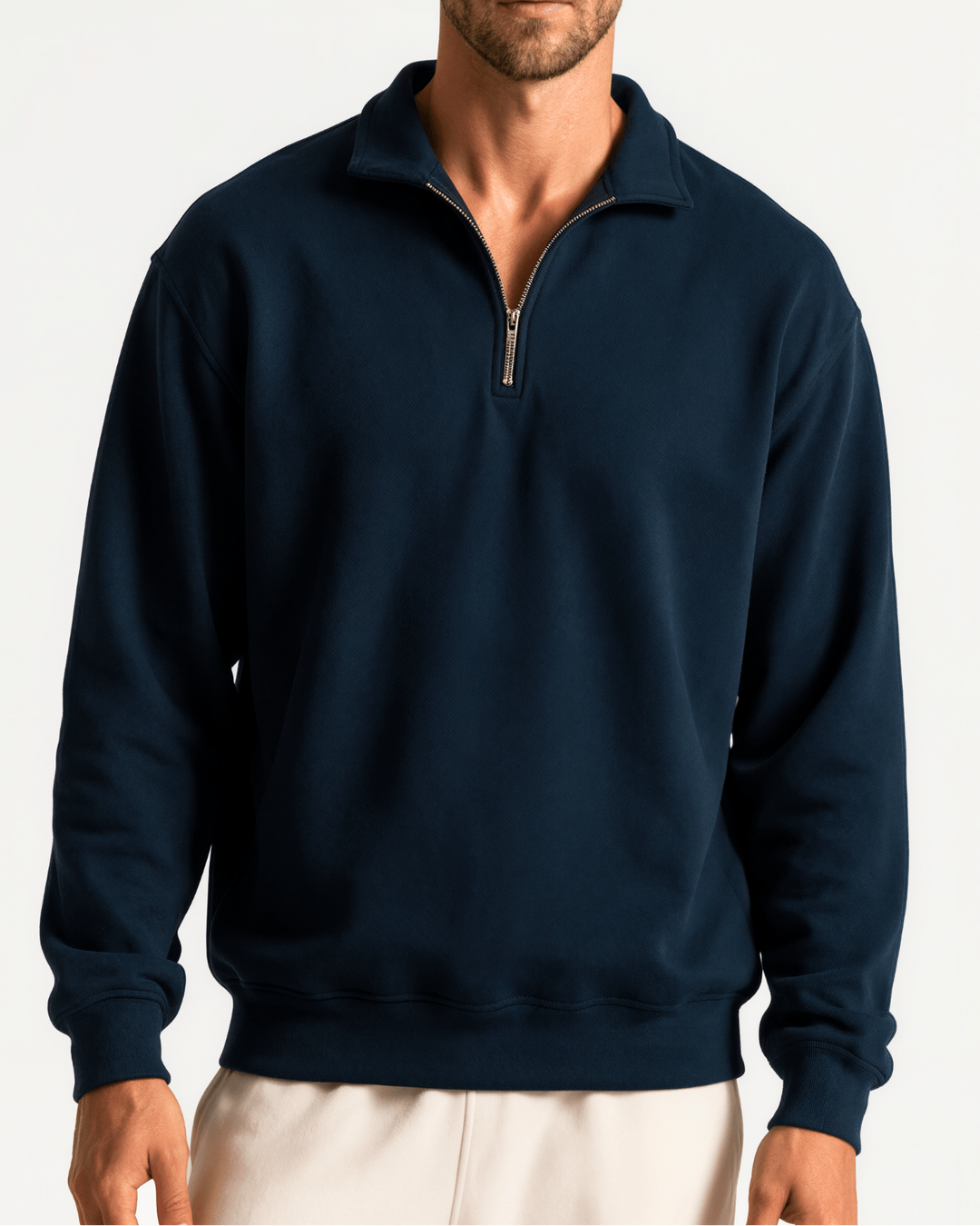Made in USA men's cotton True American navy quarter-zip pullover with a stand collar, long sleeves, ribbed cuffs and hem, shown on a male model.

