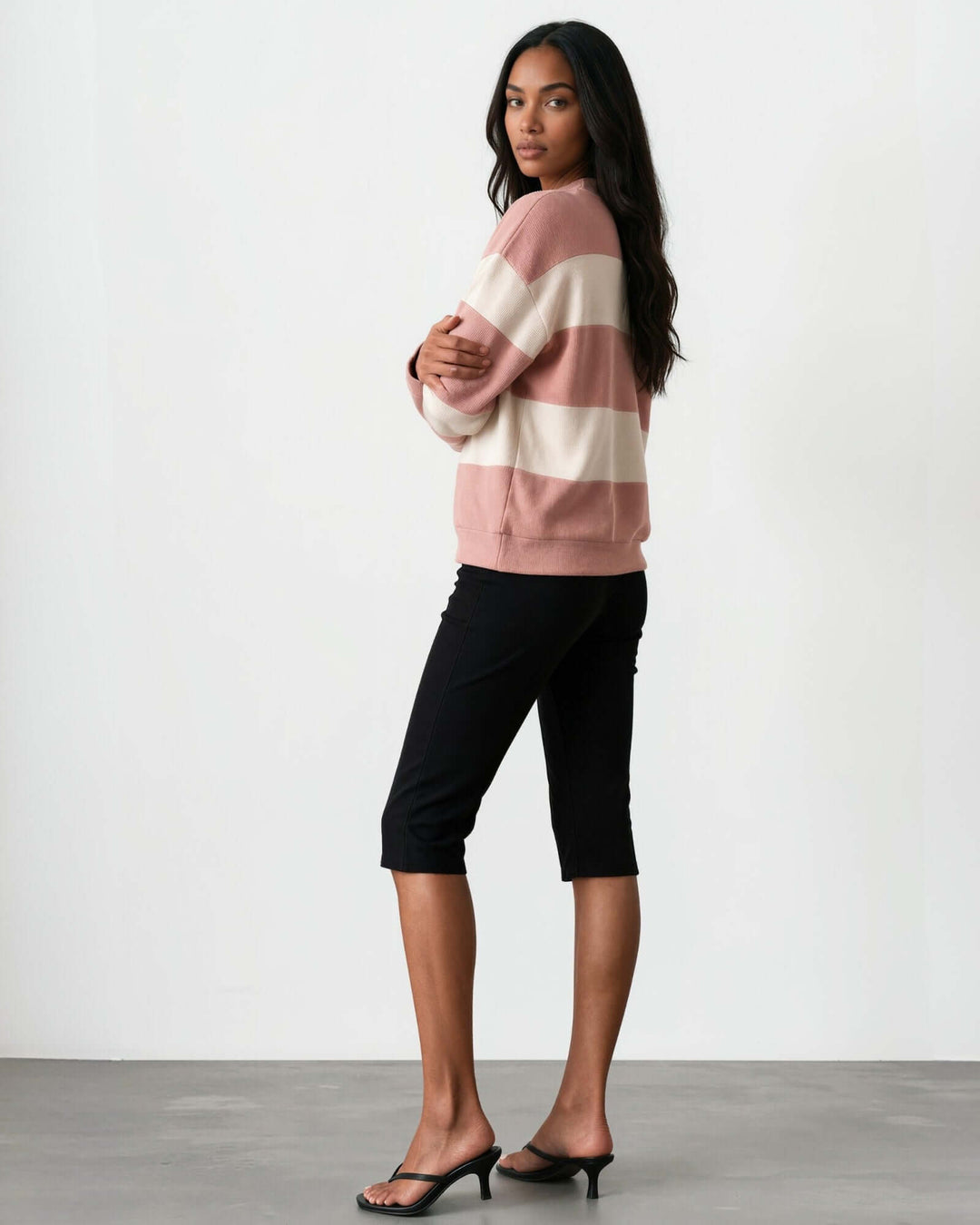 Made in USA black below-the-knee capri pants with side zipper and sleek fitted silhouette