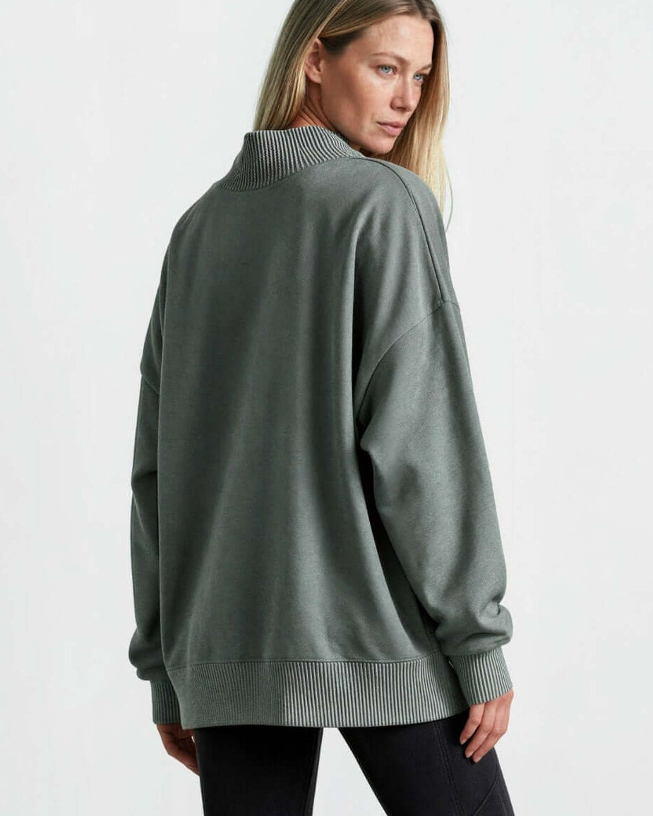 Made in USA women's sage green oversized mock neck fleece sweatshirt with collar side slit, ribbed trim, and dropped shoulders, back view