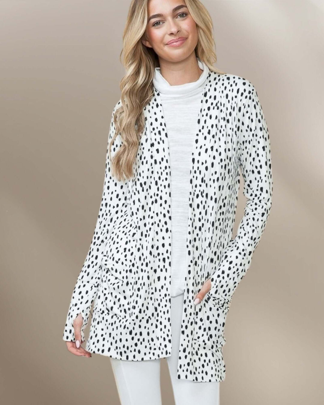 Made in USA Dolly Dot Print Cardigan: front view with hands in pockets showing open front drape