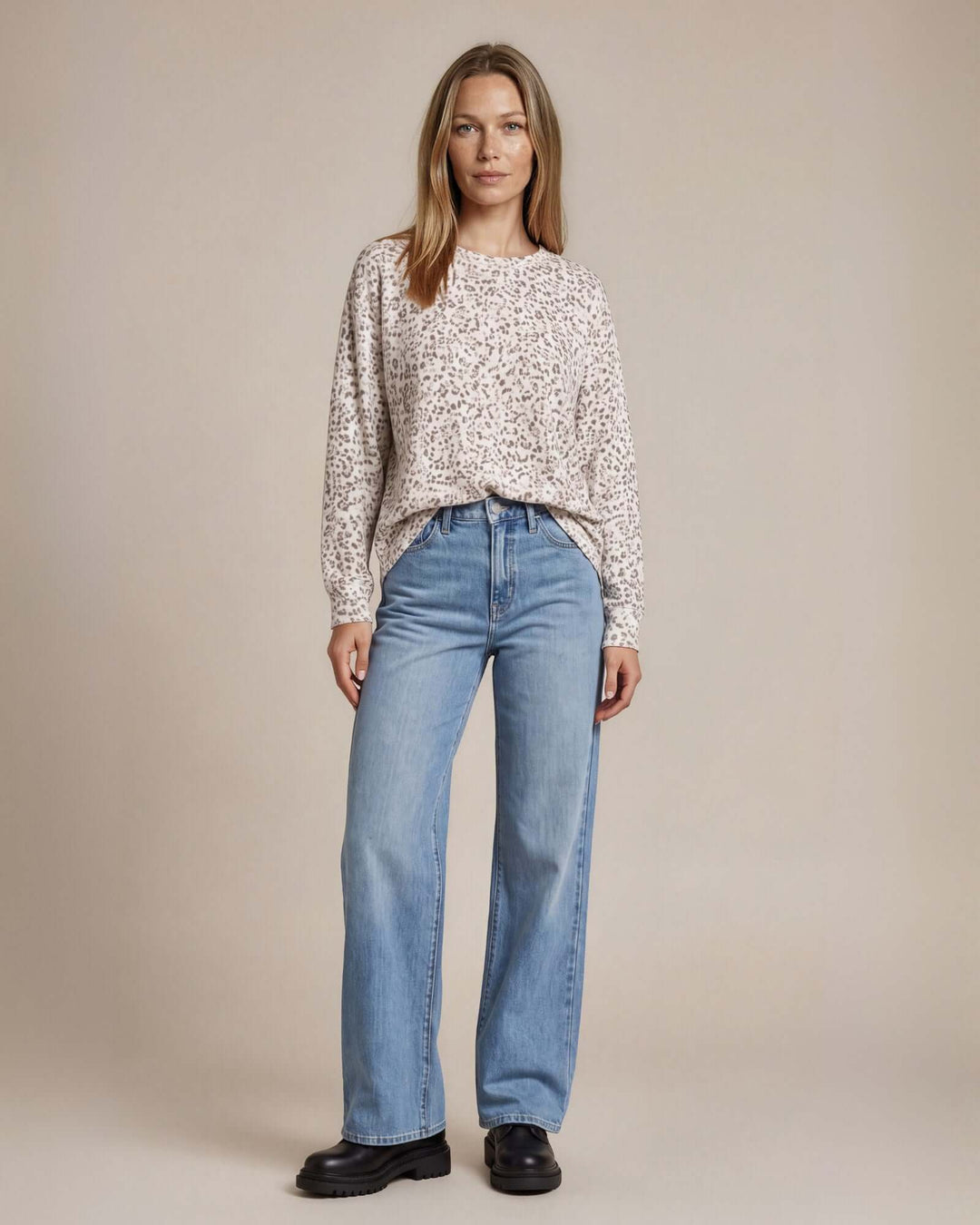 Made in USA Amelia Animal Print Oversized Sweatshirt: full-length view front-tucked into jeans with loafers