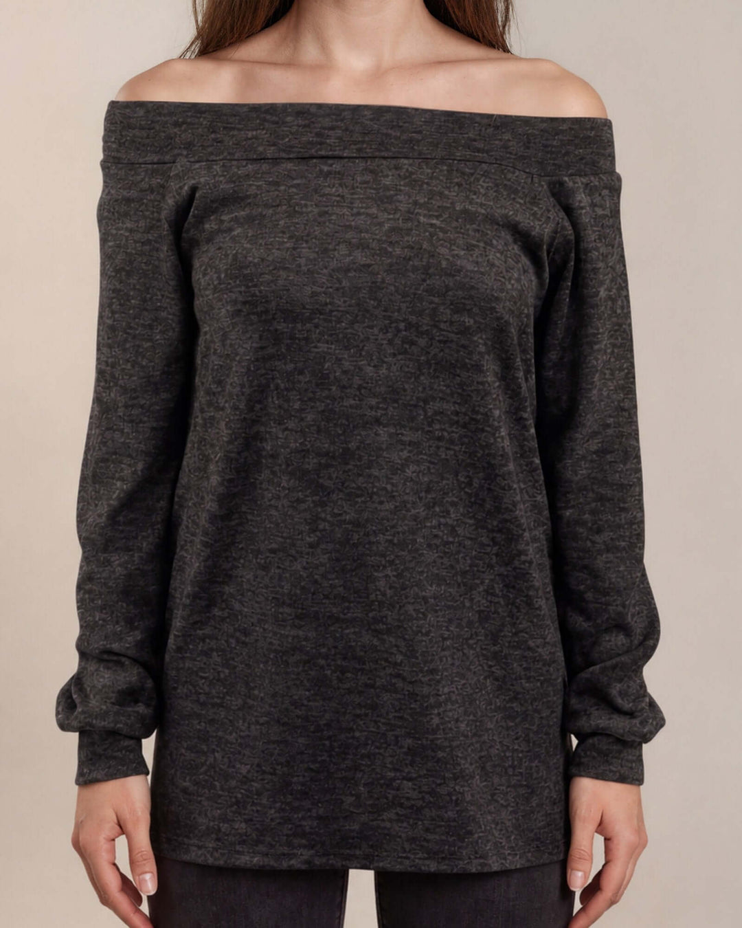 Made in USA women's charcoal black heather off-the-shoulder long sleeve knit top with raw edge seams and banded cuffs, close-up front view