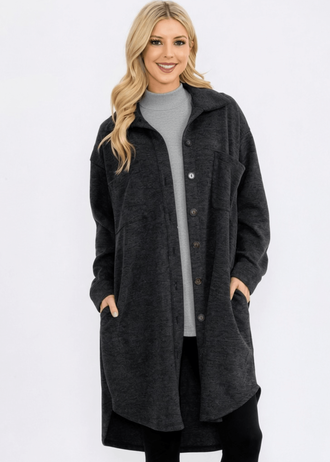 Made in USA. Layer the women's Linden longline shacket in Camel or Charcoal Black. Relaxed button-down style with soft feel, side pockets and a high-low hem.