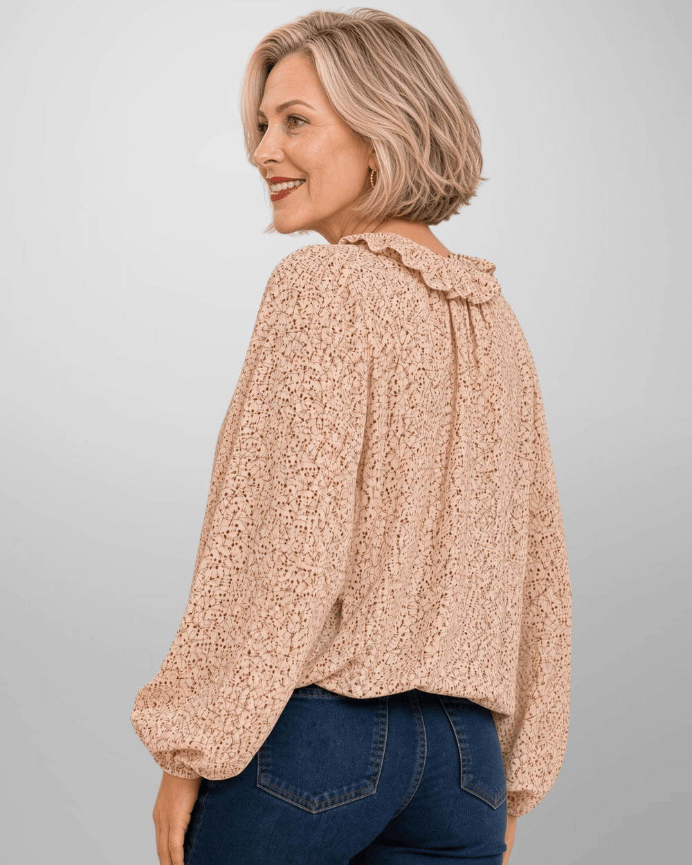Made in USA. Renee cream botanical print blouse with a ruffled V-neck, balloon sleeves and bubble hem. Lightweight woven style for casual or dressy days.