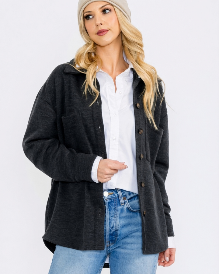 Made in USA button-down shacket with a relaxed fit, side pockets, and a medium-weight feel. Layer in Charcoal Black or Olive, sizes S–L