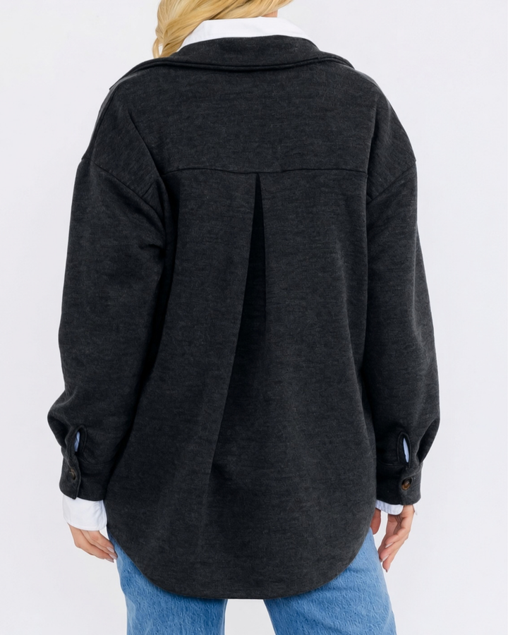 Made in USA button-down shacket with a relaxed fit, side pockets, and a medium-weight feel. Layer in Charcoal Black or Olive, sizes S–L