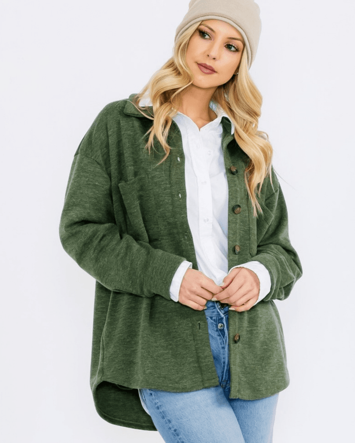 Made in USA button-down shacket with a relaxed fit, side pockets, and a medium-weight feel. Layer in Charcoal Black or Olive, sizes S–L
