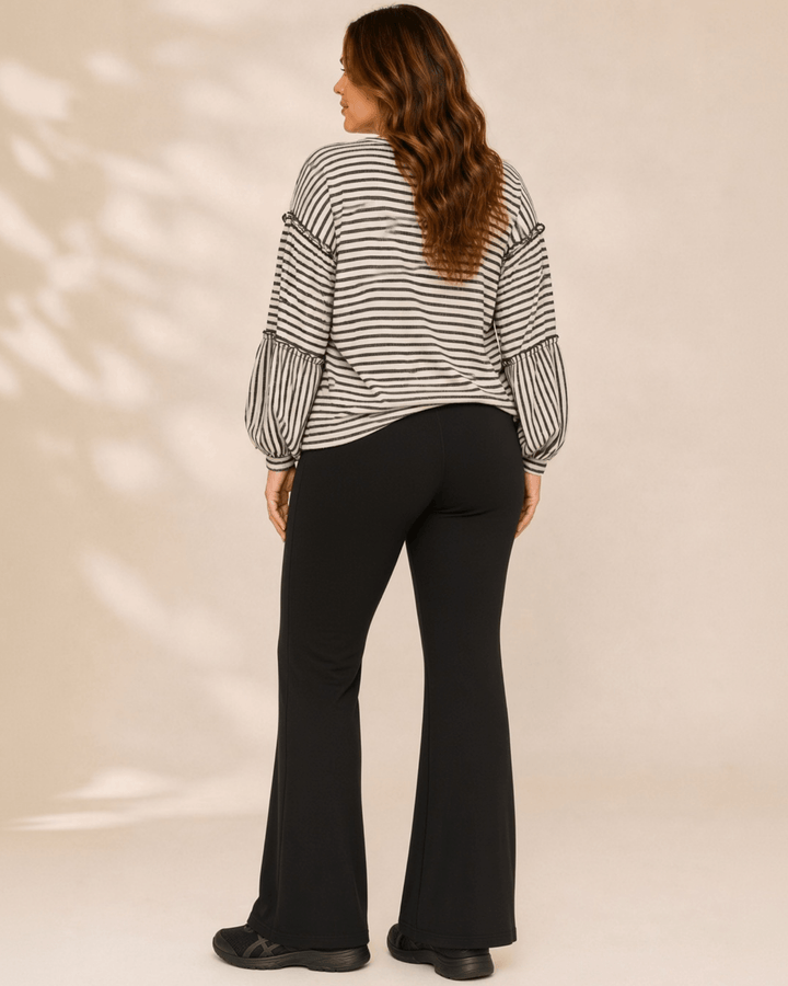 Made in USA. Tori textured striped top features stretch knit, tiered bubble sleeves and delicate ruffle trim. An easy everyday style in regular and plus sizes.