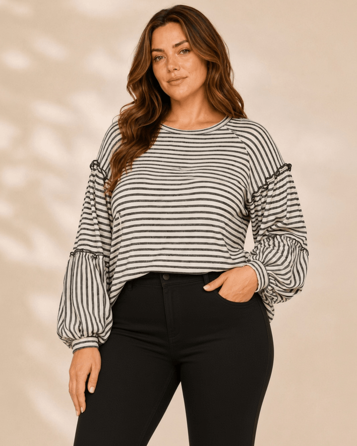 Made in USA. Tori textured striped top features stretch knit, tiered bubble sleeves and delicate ruffle trim. An easy everyday style in regular and plus sizes.