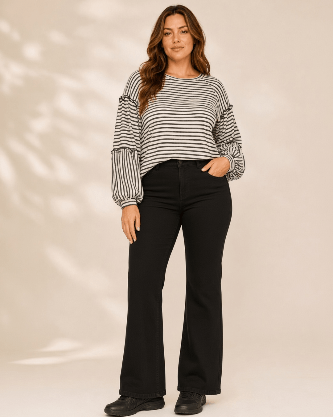 Made in USA. Tori textured striped top features stretch knit, tiered bubble sleeves and delicate ruffle trim. An easy everyday style in regular and plus sizes.