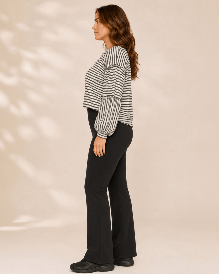 Made in USA. Tori textured striped top features stretch knit, tiered bubble sleeves and delicate ruffle trim. An easy everyday style in regular and plus sizes.