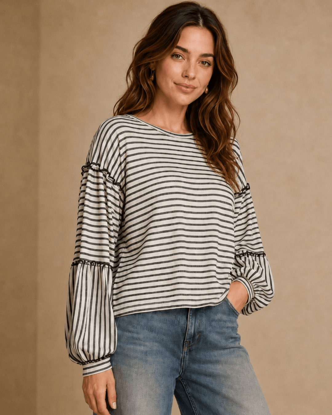 Made in USA. Tori textured striped top features stretch knit, tiered bubble sleeves and delicate ruffle trim. An easy everyday style in regular and plus sizes.