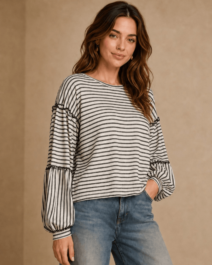 Made in USA. Tori textured striped top features stretch knit, tiered bubble sleeves and delicate ruffle trim. An easy everyday style in regular and plus sizes.