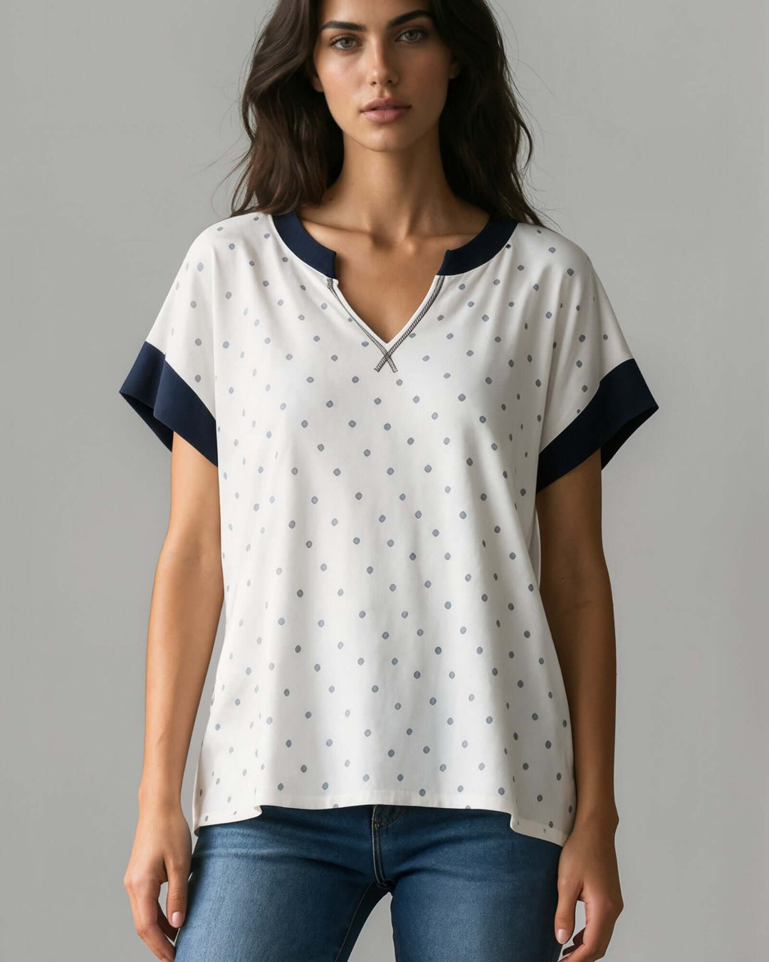 Made in USA women's white and navy polka dot split V-neck short sleeve top with navy contrast trim, front view