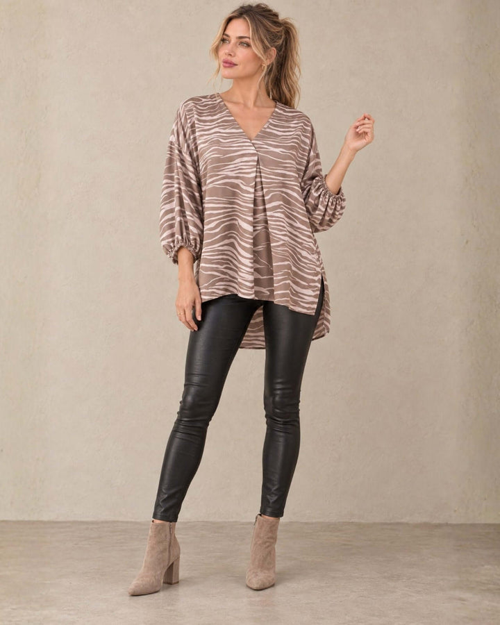 Made in USA taupe and cream zebra print blouse with V neckline, bubble sleeves, and high-low hem