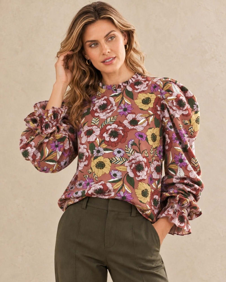 Made in USA Veronica Vintage Floral Puff Sleeve Blouse: front view with hand in hair, hands in pocket
