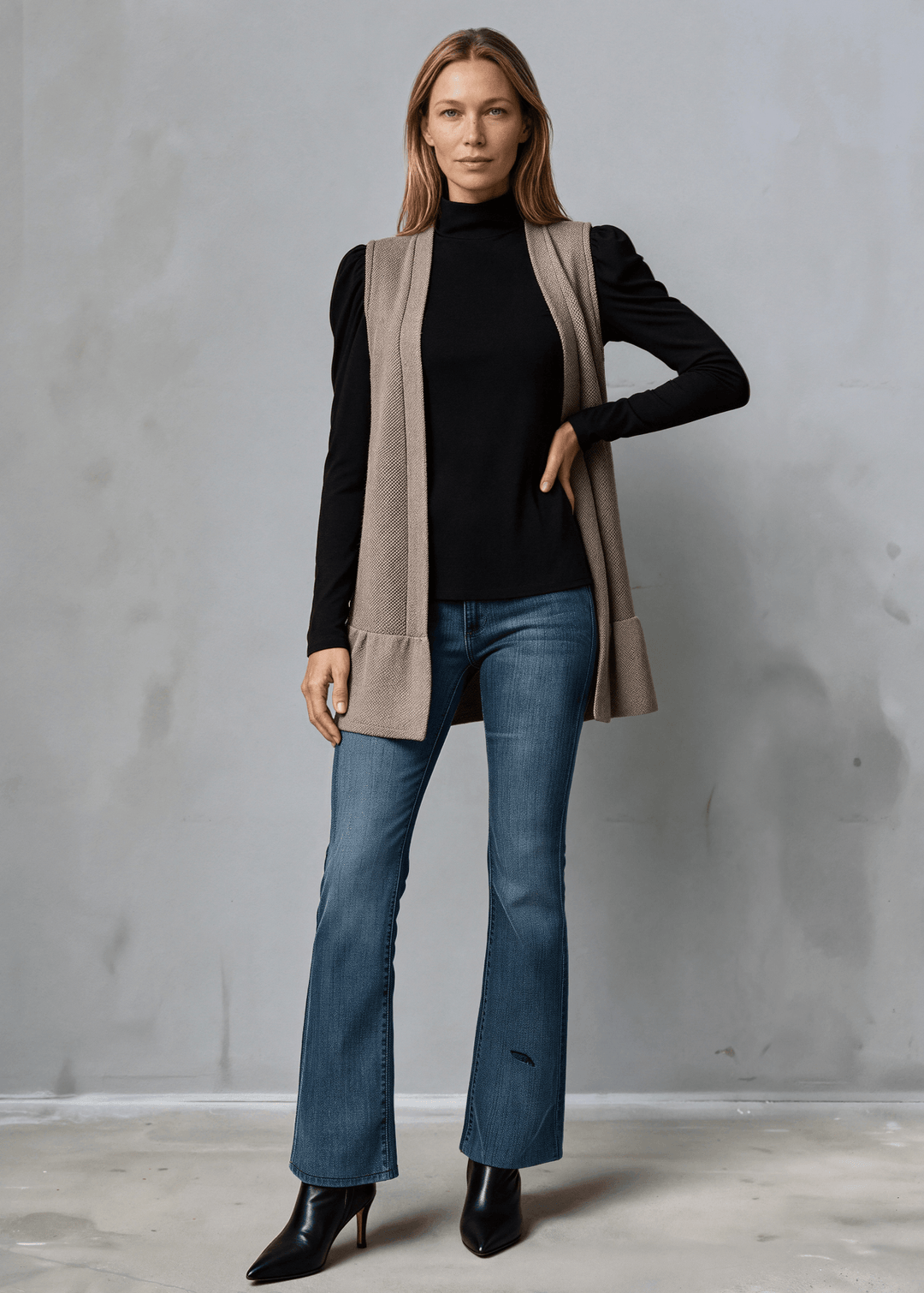 Made in USA, Your go-to layering piece for effortless style. This sleeveless cardigan features a charming flounce ruffle hem that adds movement and dimension to any outfit. 