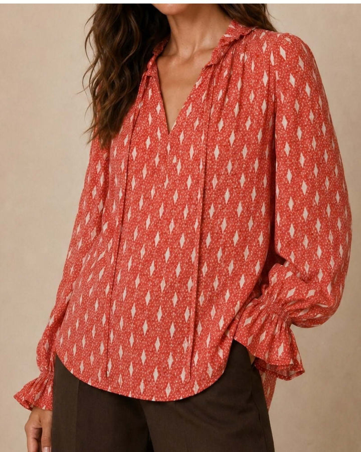 Made in USA Radiant Ruffle Neck Foil Print Blouse - Red: close-up of foil print, ruffle collar and tie strings