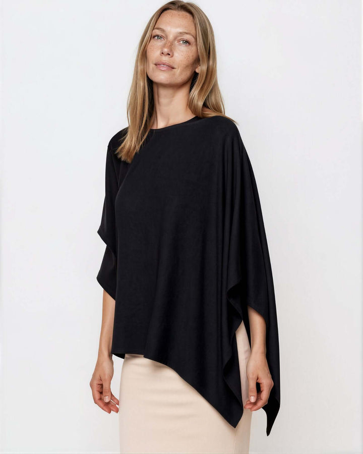 Made in USA Asymmetrical Boat Neck Poncho Top - Black: three-quarter front view of boat neck and pointed hem