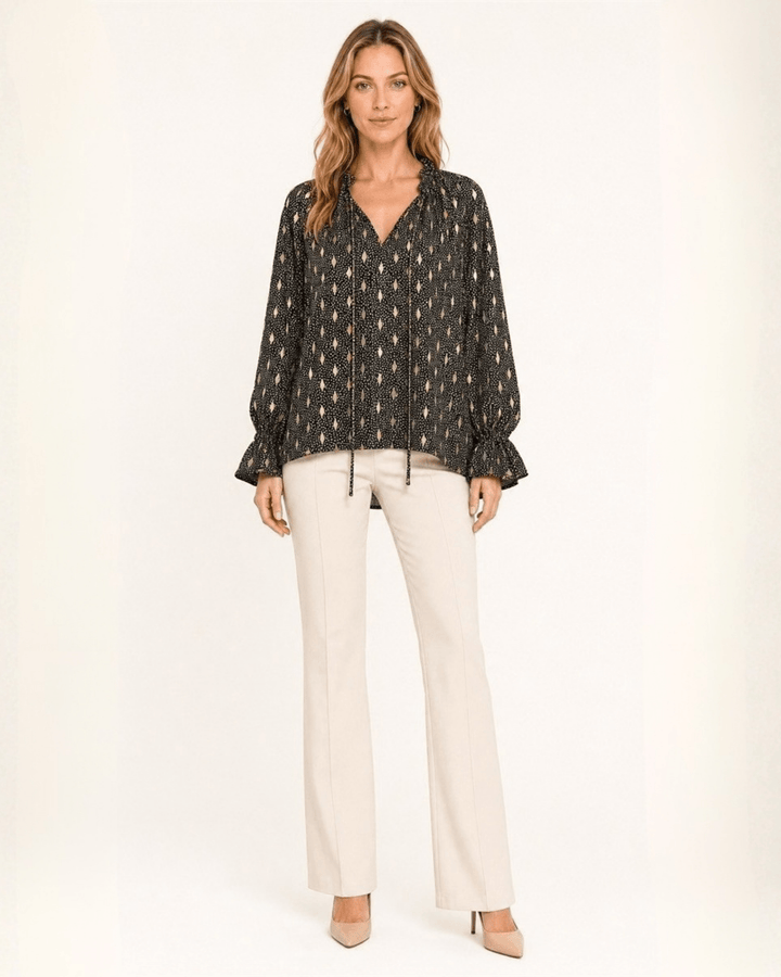 Made in USA Radiant Ruffle Neck Foil Print Blouse - Black: full-length front view with cream flares and nude heels