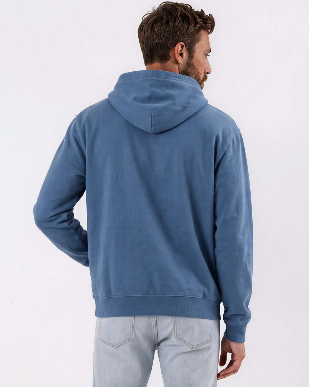 Made in USA vintage pigment dyed fleece pullover hoodie in Blue Steel with drawstring hood, front pouch pocket, and ribbed cuffs and hem