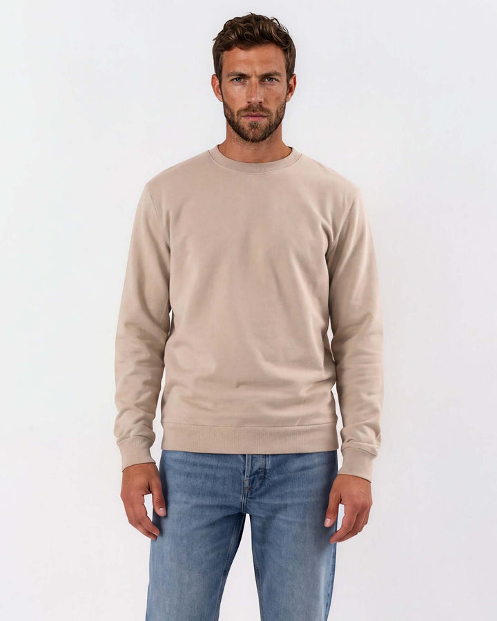 Made in USA vintage pigment dyed fleece crew sweatshirt in Khaki with ribbed crew neck, cuffs, and hem