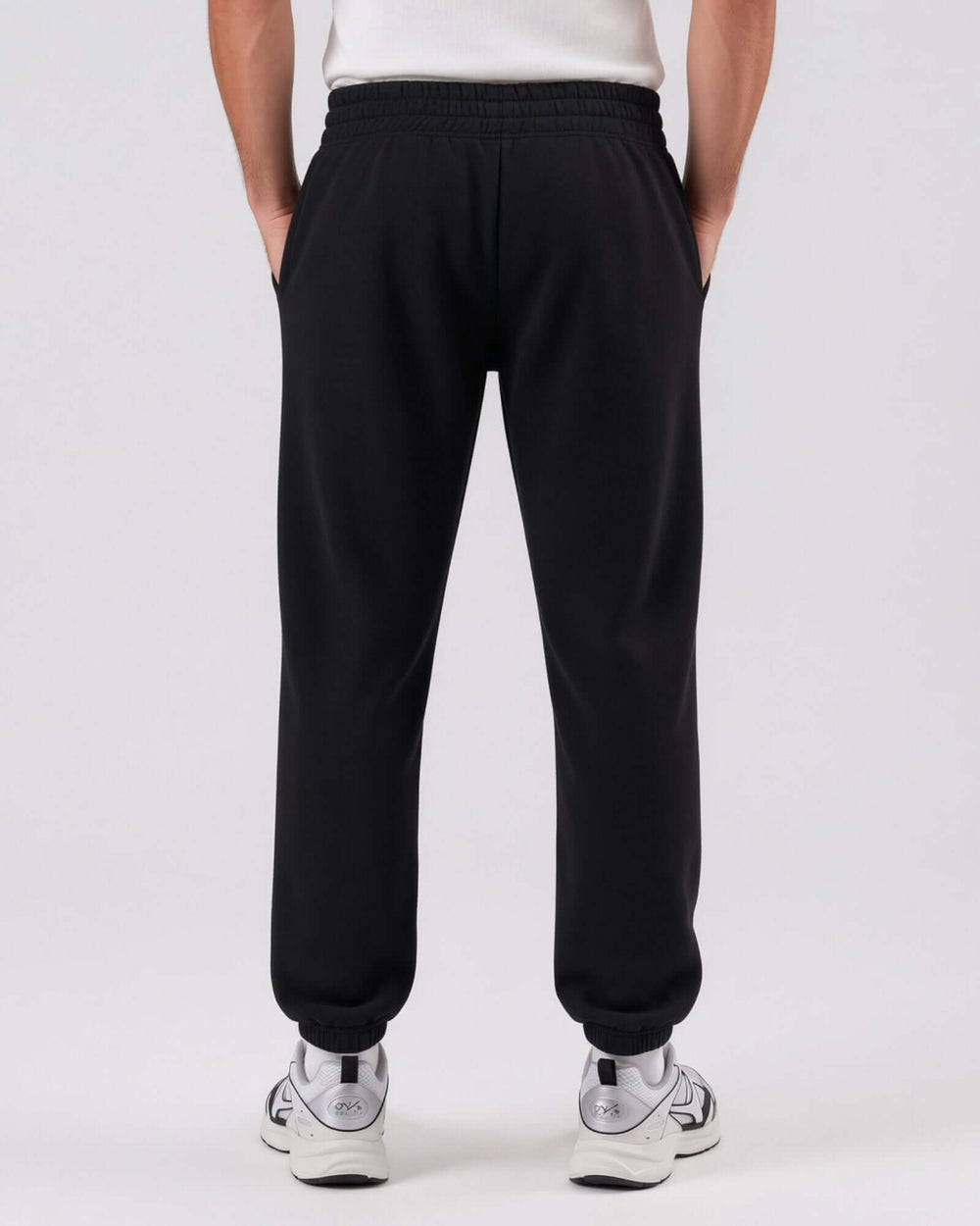 Made in USA men's black fleece lounge sweatpants with elastic waistband and rib cuffs, front view